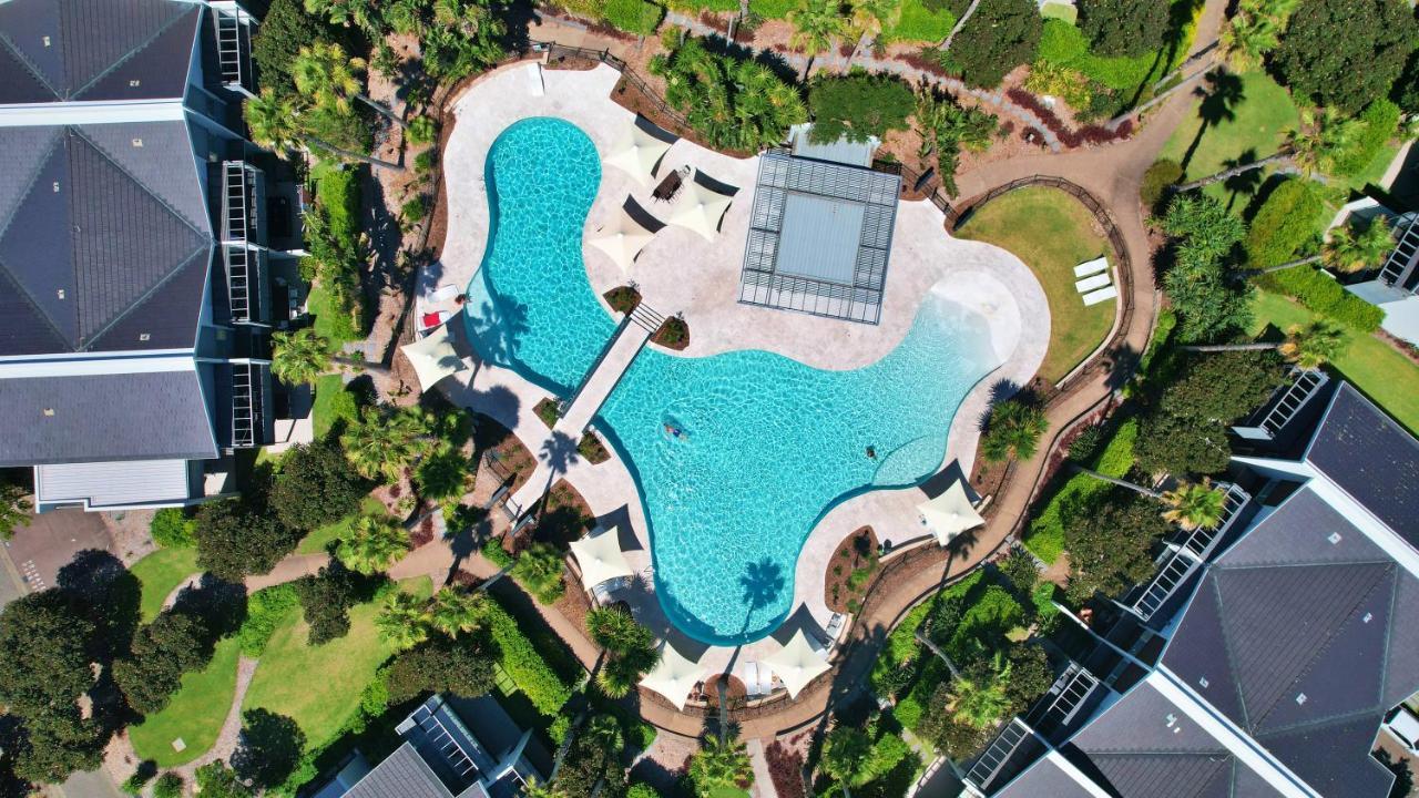 Pullman Magenta Shores Resort Entrance Exteriör bild Aerial view of the pool at the 2018 Commonwealth Games